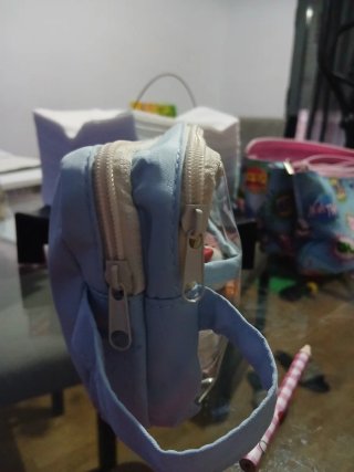 Estuche azul transparente con asa