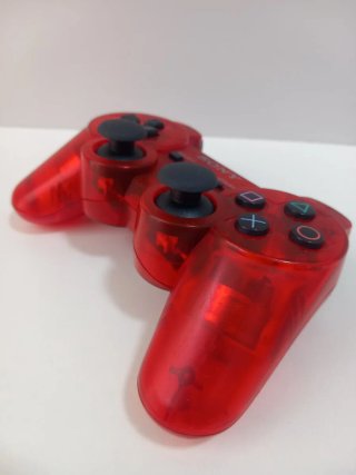 Mando ps3 rojo traslúcido.