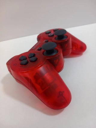 Mando ps3 rojo traslúcido.