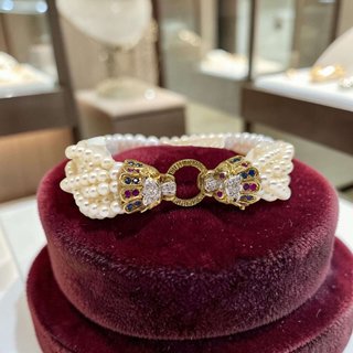 pulsera-leones-perlas-oro