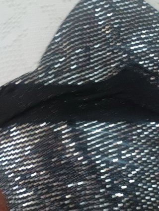 Pantalón corto lentejuelas negro y plata