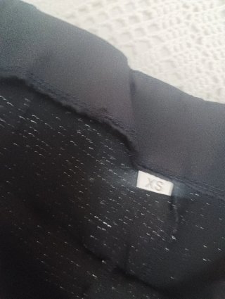 Pantalón corto lentejuelas negro y plata