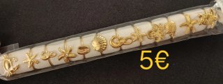 Anillos dorados con motivos marinos