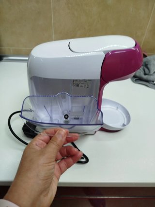 Cafetera Bosch morada y Blanca