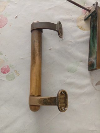Maniglia e batti porta in ottone