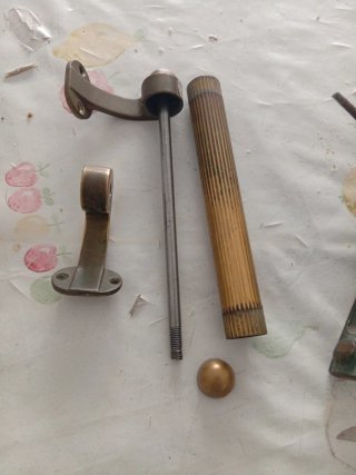 Maniglia e batti porta in ottone
