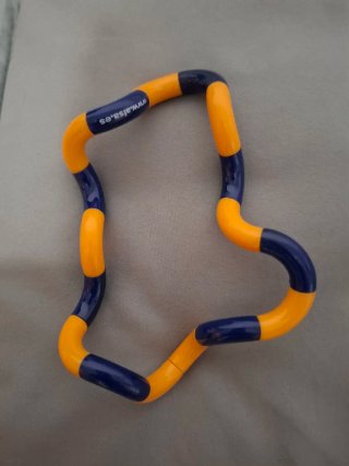 Juguete Tangle Naranja y Azul