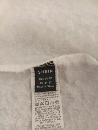 Pantalón corto blanco texturizado