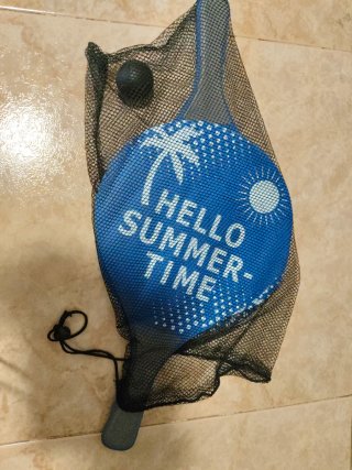 Palas de playa con pelota y bolsa