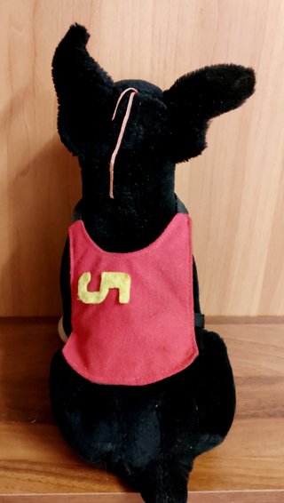 Peluche cane nero e marrone