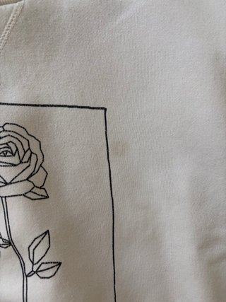 Sudadera Primark Blanca con Dibujo Rosa.