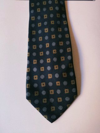 Corbata azul y dorada con estampado