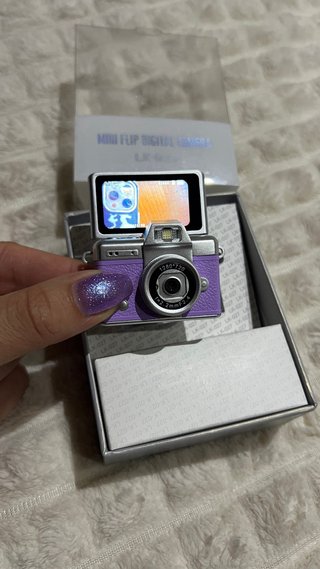 Mini cámara lila 1080p