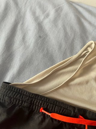 Bañador niño Decathlon negro naranja talla 10aprox