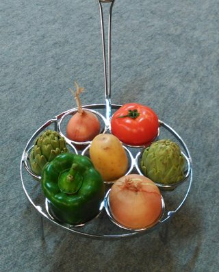 Parrilla para verduras con mango de madera.