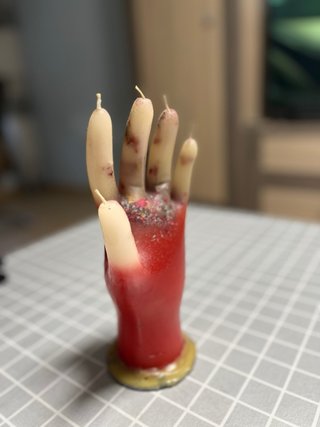 Vela mano roja y beige
