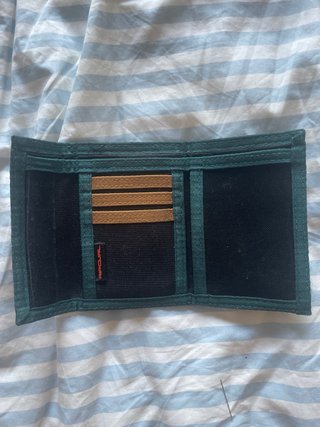 Cartera Rip Curl Negra y Marrón