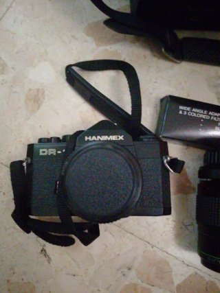 Cámara Hanimex con accesorios