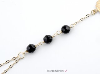 manita oro 18k con piedra con onix