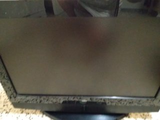 Televisor OKI Plano Negro con mando a distancia