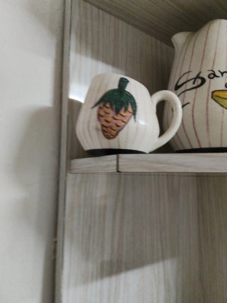 Juego de jarras y tazas de cerámica