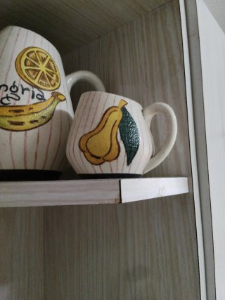 Juego de jarras y tazas de cerámica