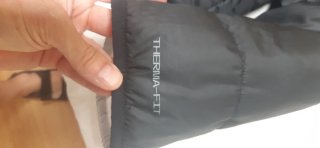Plumas Nike Negro unisex. Reversible.