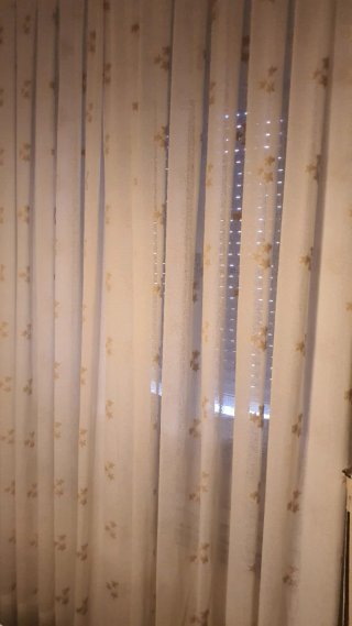 Cortinas beige y doradas