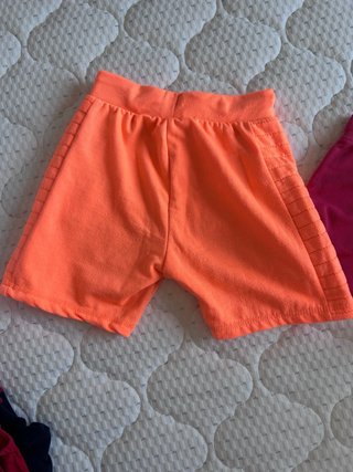 Pantaloncini arancioni con laccetti taglia 134/140