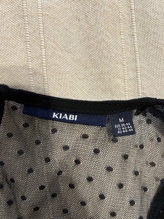 Blusa negra Kiabi talla M con volantes