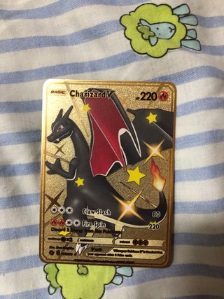 Cartas Pokémon Charizard DX y V Metálicas