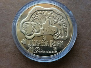 Moneda Jurassic Park Dorada