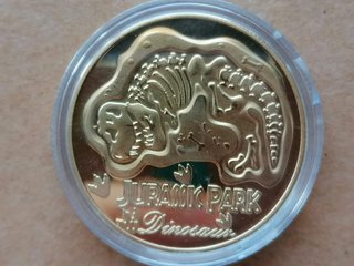 Moneda Jurassic Park Dorada