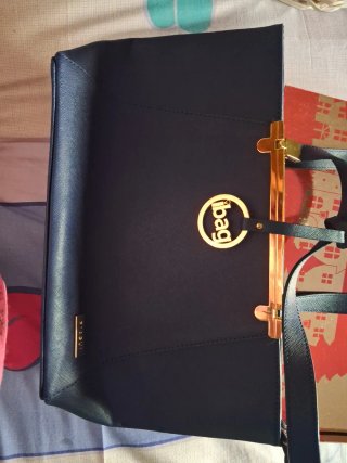 Bolso de mano PIAGUI negro y dorado