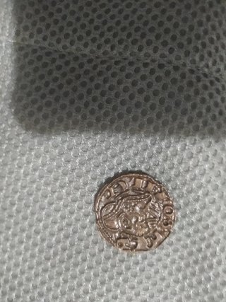 Moneda antigua con diseño