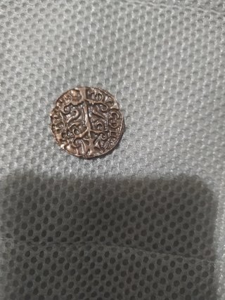 Moneda antigua con diseño