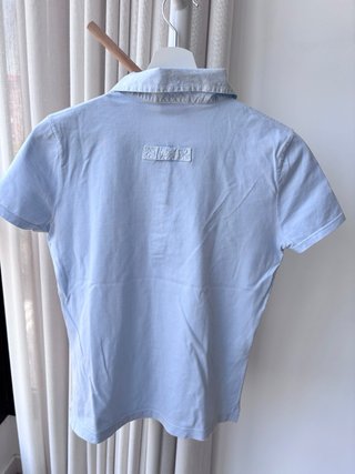 Polo Lacoste azul claro manga corta chica T.S