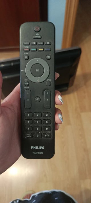 Televisor Philips Negro y samsonite negro