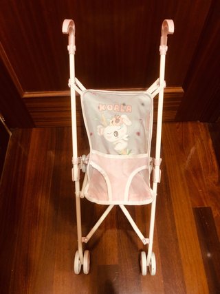 Silla de paseo para muñecas rosa