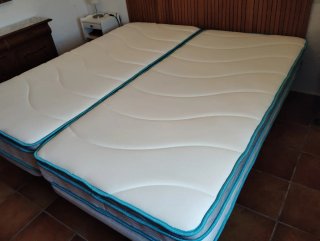 Dos colchones híbridos Linenspa 90x190 cm.