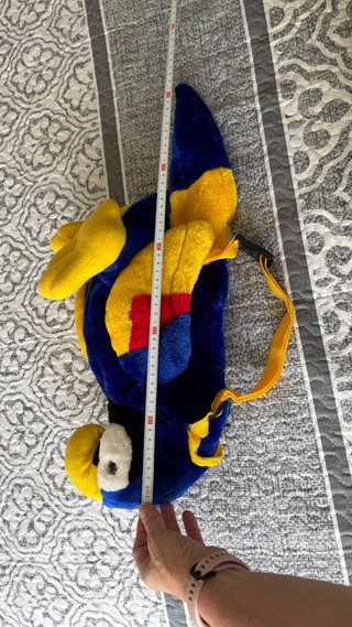 Mochila loro azul y amarillo. Nueva