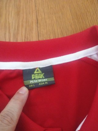 Polo sportivo Peak Taglia L