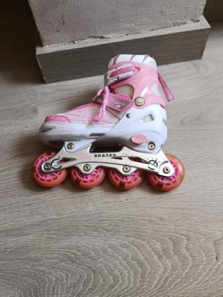 Patines rosas con luces y rodilleras