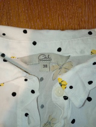 Camicia donna smanicata a fiori gialli