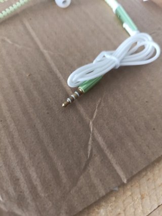 Auriculares verdes tipo cremallera