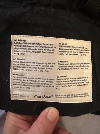 Mochila Porta Bebé Manduca Negra y reductor
