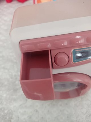 Lavadora de juguete rosa