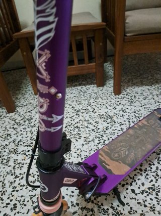 Patinete Oxelo Morado Ajustable y plegable.