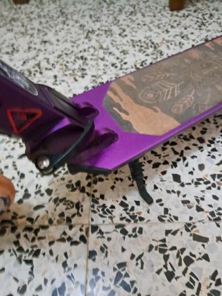Patinete Oxelo Morado Ajustable y plegable.