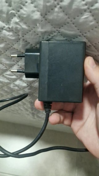 Mando original  + adaptador y cargador original
